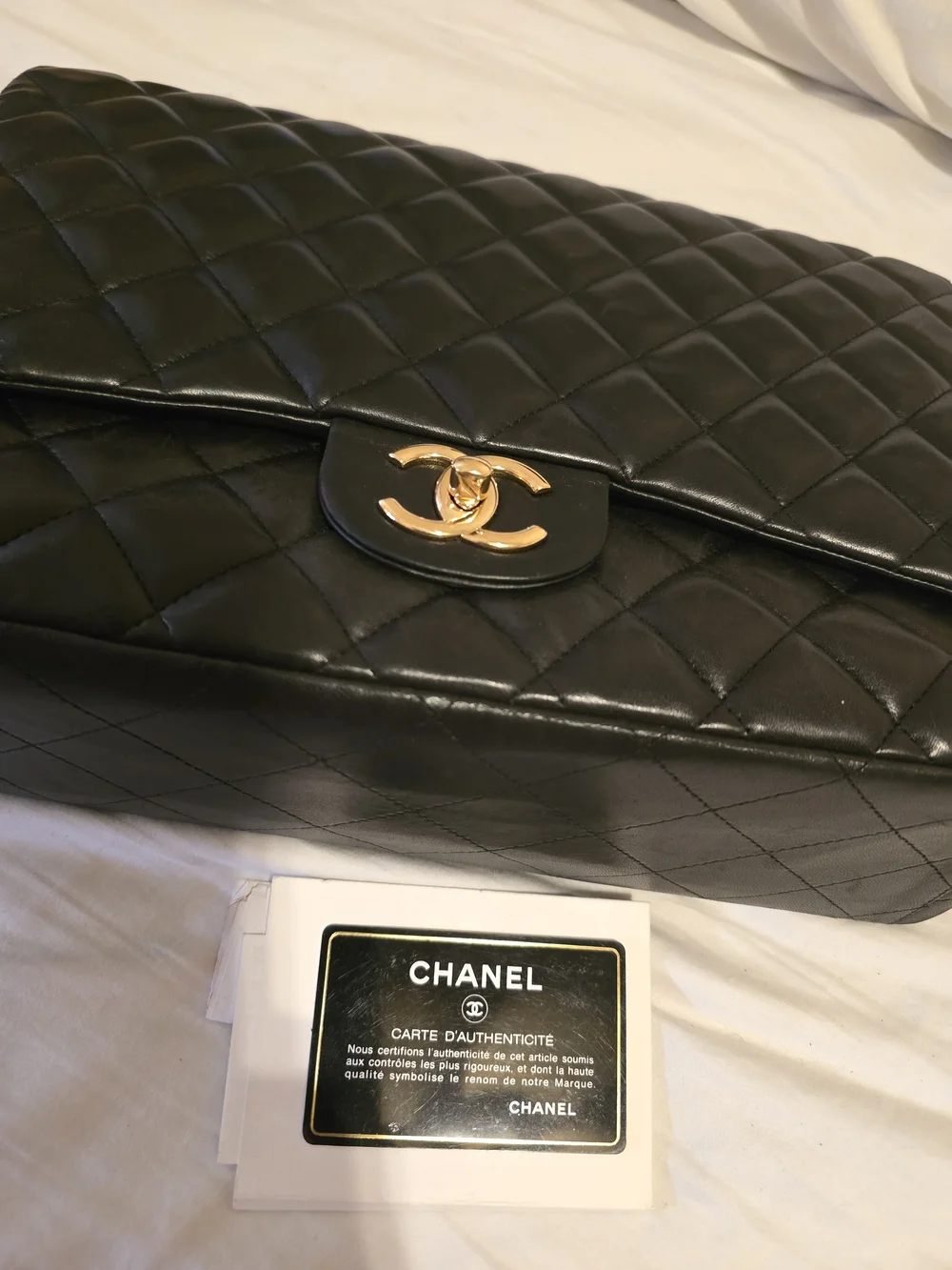 CHANEL Classic Quilted Black Lambskin Shoulder Bag with Gold CC